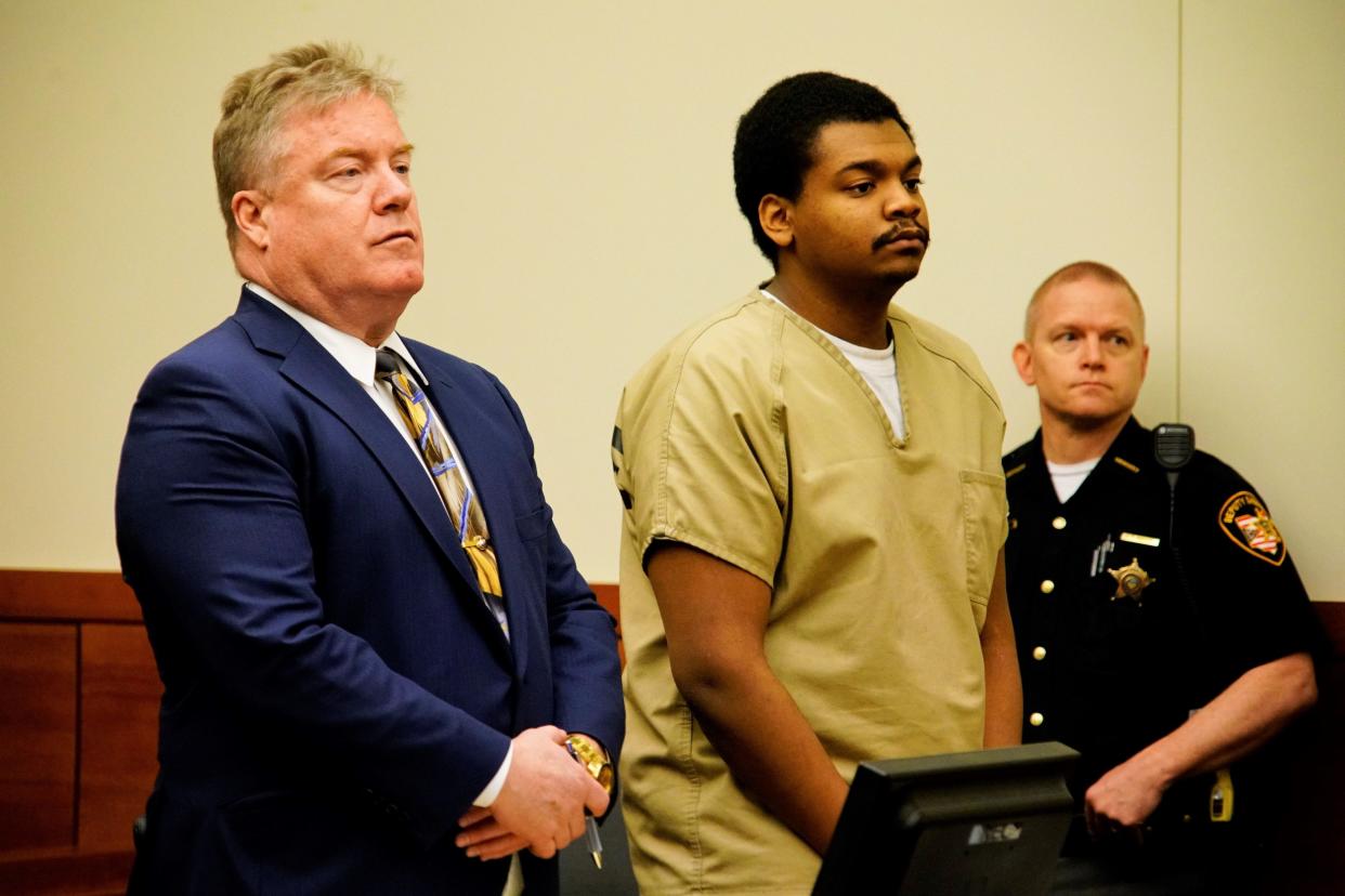 Q'Juantez Poole, 23, of Columbus' Northwest Side, center, stood with his defense attorney, Joseph R. Landusky II on Thursday when Franklin County Common Pleas Judge Kimberly Cocroft sentenced Poole to life in prison with eligibility for parole after more than 24 years in fatal 2020 shooting of 26-year-old Donte Wiley and wounding a woman with Wiley.