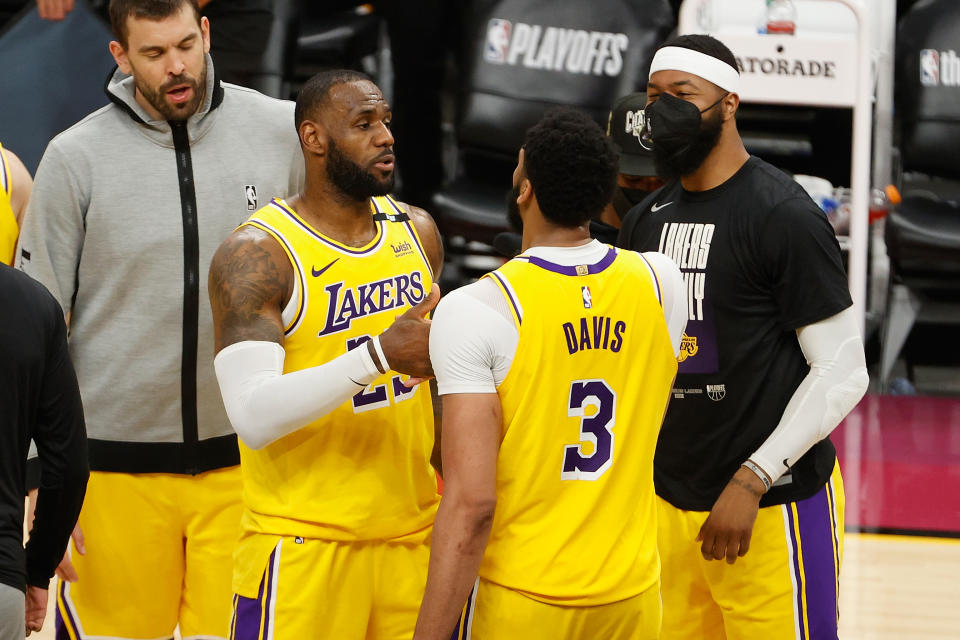 PHOENIX, ARIZONA - MAY 25: LeBron James #23 of the Los Angeles Lakers celebrates with Anthony Davis #3 after defeating the Phoenix Suns in  Game Two of the Western Conference first-round playoff series at Phoenix Suns Arena on May 25, 2021 in Phoenix, Arizona. The Lakers defeated the Suns 109-102.  NOTE TO USER: User expressly acknowledges and agrees that, by downloading and or using this photograph, User is consenting to the terms and conditions of the Getty Images License Agreement.  (Photo by Christian Petersen/Getty Images)