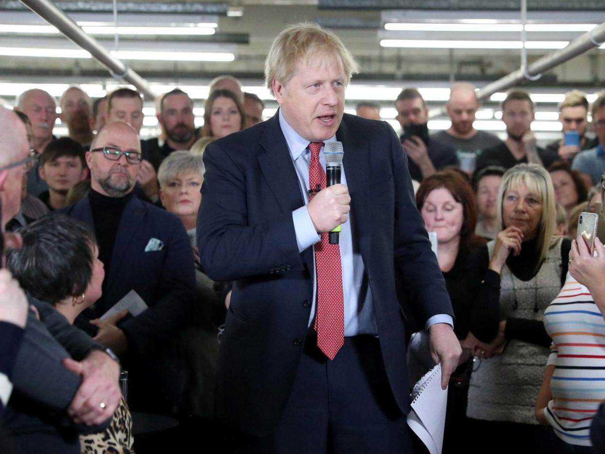 Boris Johnson speaks to workers during a Conservative Party general election campaign: AFP/Getty