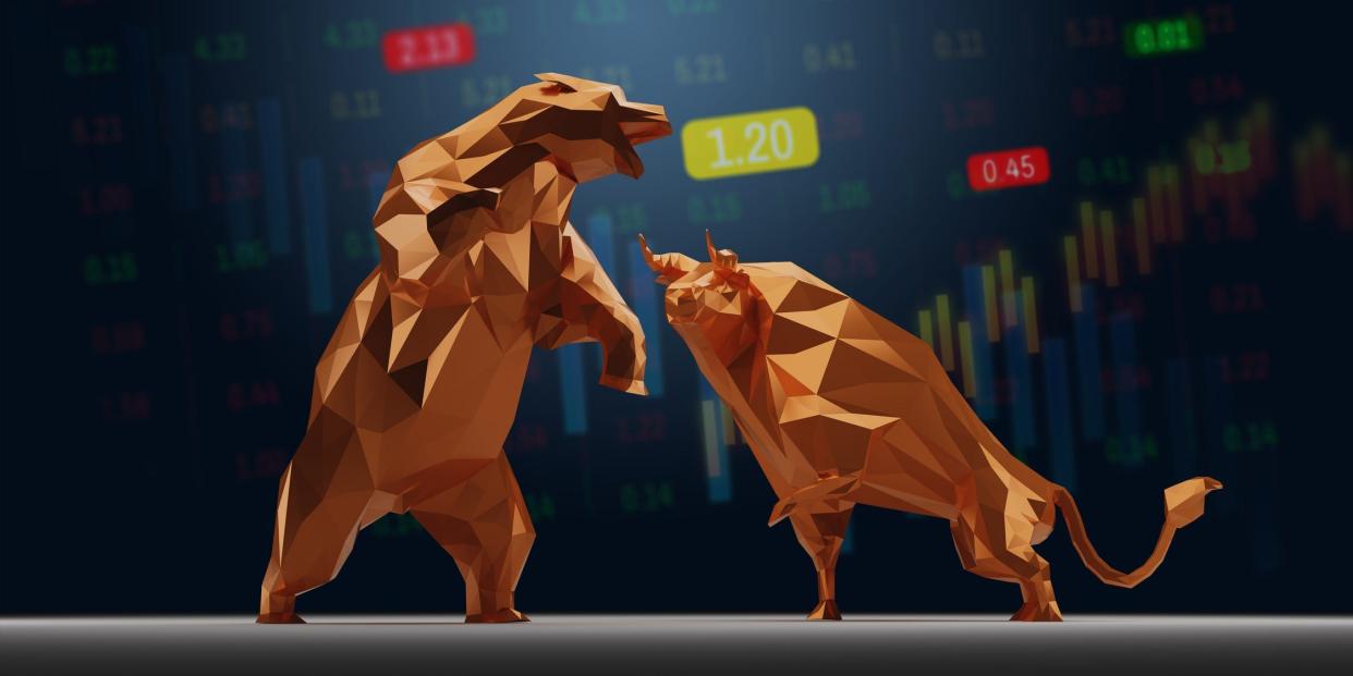 Animated bear and bull faces each other in front of stock charts