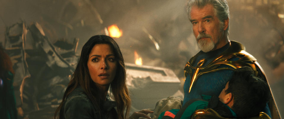 (L-r) SARAH SHAHI as Adrianna and PIERCE BROSNAN as Dr. Fate in New Line Cinema’s action adventure “BLACK ADAM,” a Warner Bros. Pictures release.
