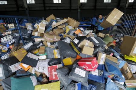 Employees work at a sorting centre of Zhongtong (ZTO) Express ahead of the Singles Day shopping festival, Chaoyang District, Beijing, November 8, 2015 REUTERS/Jason Lee