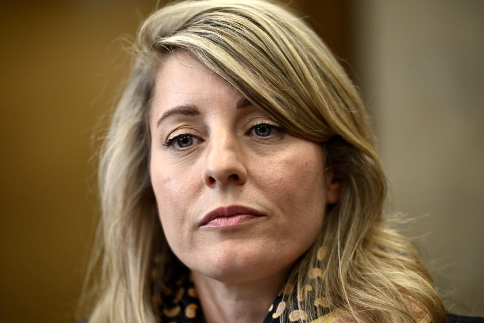 Minister of Foreign Affairs Melanie Joly listens to questions from reporters in the Foyer of the House of Commons on Parliament Hill, in Ottawa, Ontario, Monday, Sept. 18, 2023, after Prime Minister Justin Trudeau announced that Canadian authorities had intelligence that India’s government may have had links to the June assassination of a Sikh activist in Canada. (Justin Tang/The Canadian Press via AP)