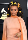 <p>Andra Day added flowers to her hair, which paired perfectly with her vintage Christian Dior gown. (Photo: Getty Images) </p>