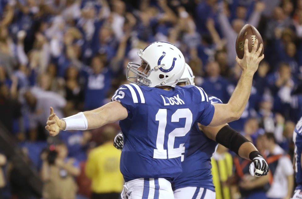 After scoring a touchdown against the Kansas City Chiefs, Indianapolis Colts quarterback Andrew Luck (12) celebrates during the second half of an NFL wild-card playoff football game Saturday, Jan. 4, 2014, in Indianapolis. (AP Photo/Michael Conroy)