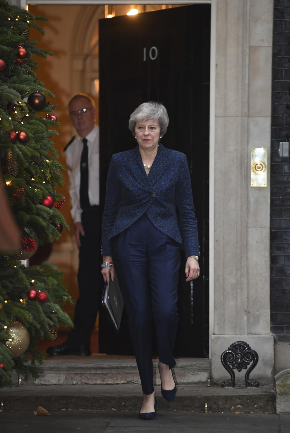 Britain's Prime Minister Theresa May prepares to make a media statement in Downing Street, London, confirming there will be a vote of confidence in her leadership of the Conservative Party, Wednesday Dec. 12, 2018. The vote of confidence will be held in Parliament Wednesday evening, with the result expected to be announced soon after. (Stefan Rousseau/PA via AP)