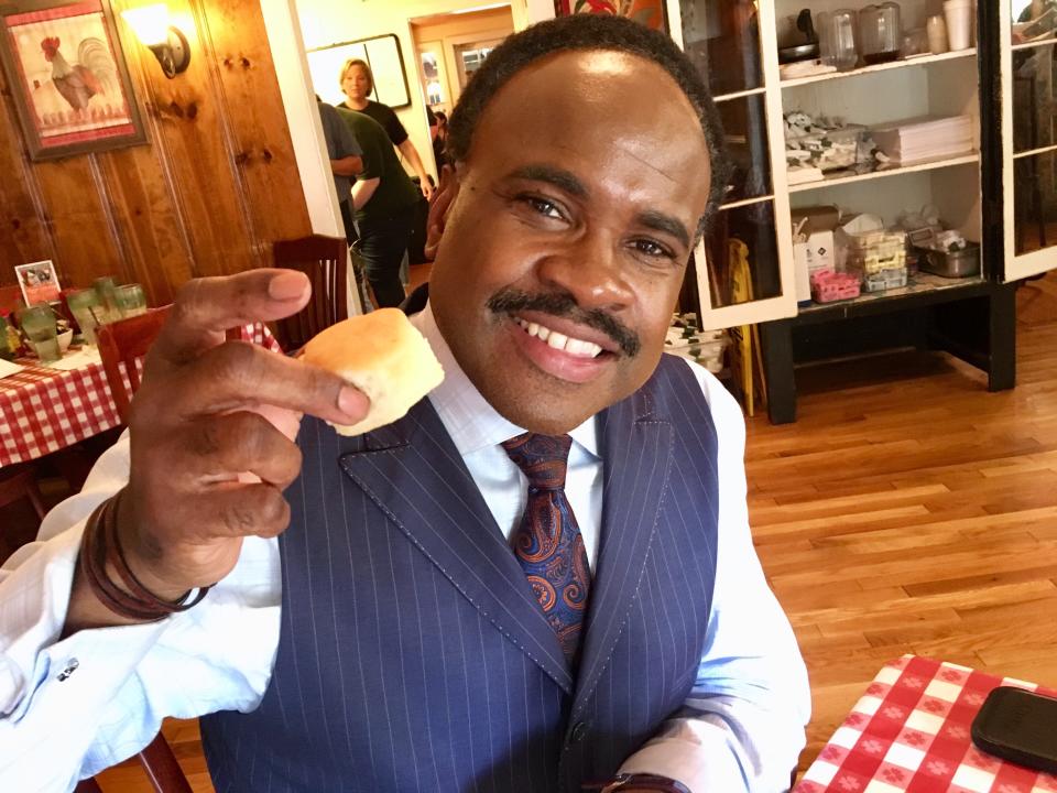 NewsChannel 5 meteorologist Lelan Statom, volunteer biscuit taster for the Tennessean, tries one in 2018 at Loveless Cafe on Highway 100 in Bellevue