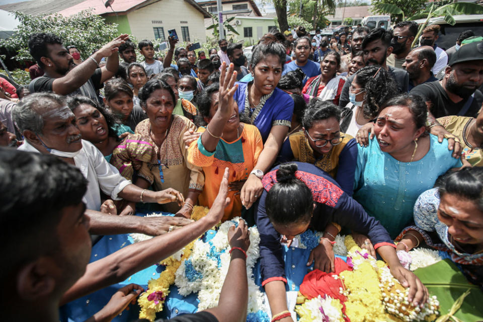 Family members seen weeping when paying their last respects for Nagaenthran who was cremated at the Buntong Crematorium centre in Ipoh, April 29, 2022. — Picture by Farhan Najib