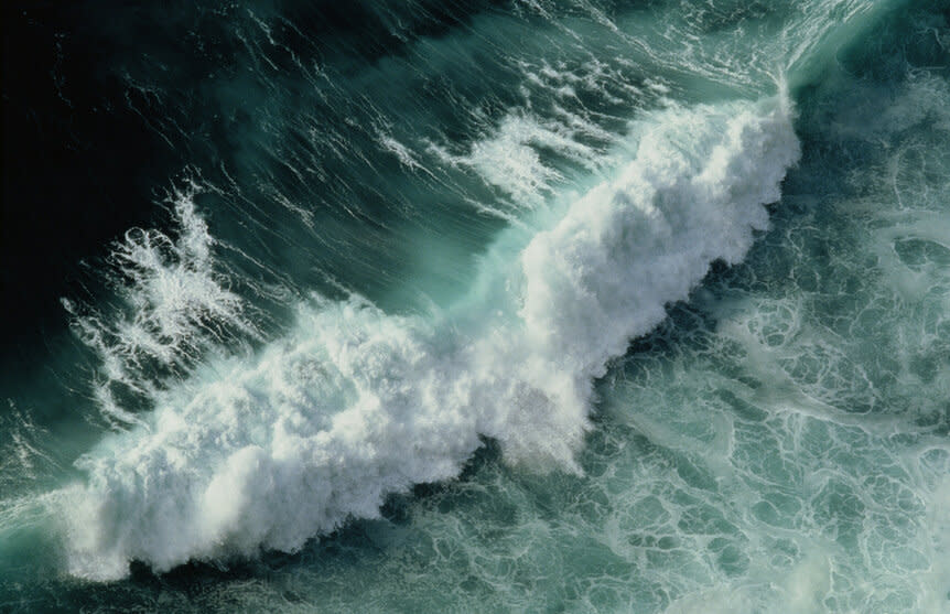 Ocean wave crashing, overhead view