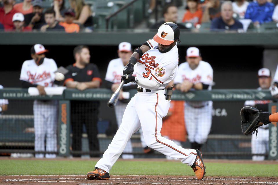 Baltimore Orioles' Cedric Mullins hits a double against the Houston Astros in the first inning of a baseball game, Wednesday, June 23, 2021, in Baltimore. (AP Photo/Will Newton)