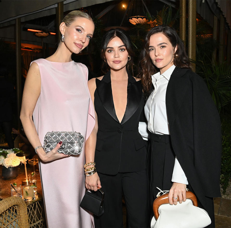 Leonie Hanne, Lucy Hale, and Zoey Deutch pose as Max Mara celebrates Yara Shahidi at the 2023 WIF Max Mara Face of the Future Award Recipient Cocktail Event on November 29, 2023 in Los Angeles, California.