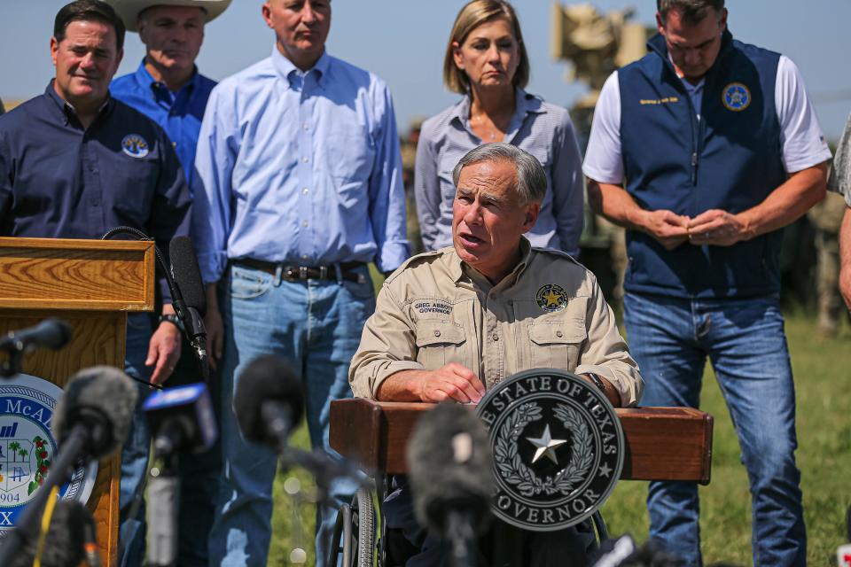 Texas Gov. Greg Abbott, backed by other Republican state governors, Texas National Guard leaders, and law enforcement officers, speaks at a press conference on the U.S. southern border in Mission, Texas, on Oct. 6, 2021.