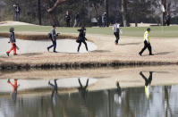 Journalists walk on the golf course during a media tour of Kasumigaseki Country Club golf course, one the venues of the Tokyo 2020 Olympics, in Kawagoe near Tokyo , Monday, Feb. 25, 2019. Golf returned to the Olympic three years ago in Rio de Janeiro. But few play golf in Brazil. It should be different at the Tokyo Olympics. (AP Photo/Koji Sasahara)