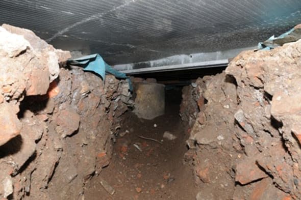 Undated handout photo issued by Greater Manchester Police of a 50 ft tunnel that was dug by thieves from nearby wasteland into the Tesco on Liverpool Road, Eccles. A significant amount of cash was taken from an ATM during the theft on Friday March 14th.  PRESS ASSOCIATION Photo. Issue date: Thursday March 20, 2014. See PA story POLICE Tunnel. Photo credit should read: GMP/PA Wire NOTE TO EDITORS: This handout photo may only be used in for editorial reporting purposes for the contemporaneous illustration of events, things or the people in the image or facts mentioned in the caption. Reuse of the picture may require further permission from the copyright holder.