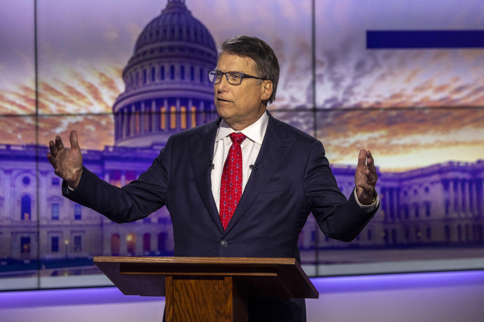 Republican U.S. Senate candidate Pat McCrory answers a question during an hour-long debate moderated by Spectrum News political anchor Tim Boyum at the Spectrum News studio in Raleigh, N.C. Wednesday, April 20, 2022. (Travis Long/The News & Observer via AP)