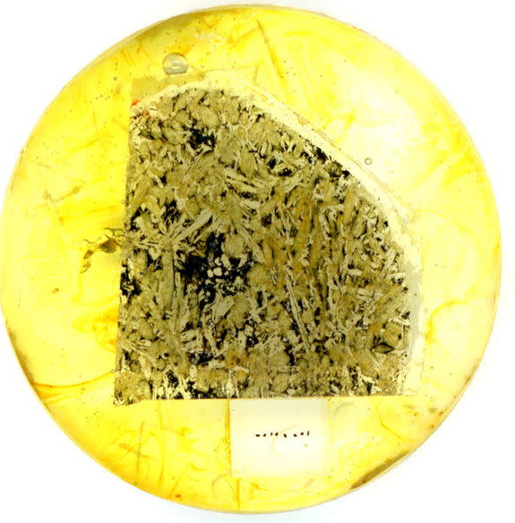 An optical image of a slice of Martian meteorite NWA 5298, mounted for growth history analysis of the crystals and isotopic dating using electron and ion beam techniques. The Martian lava flow cooled to form the interlocking mineral texture ~20