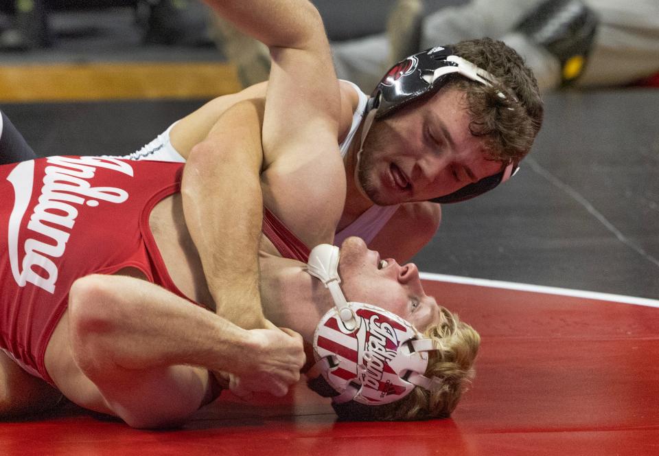 Dylan Shawver (top), shown earlier this season, became the third Big Ten Conference champion in Rutgers' history Sunday with a dominant win by technical fall over Michigan's Dylan Ragusin.