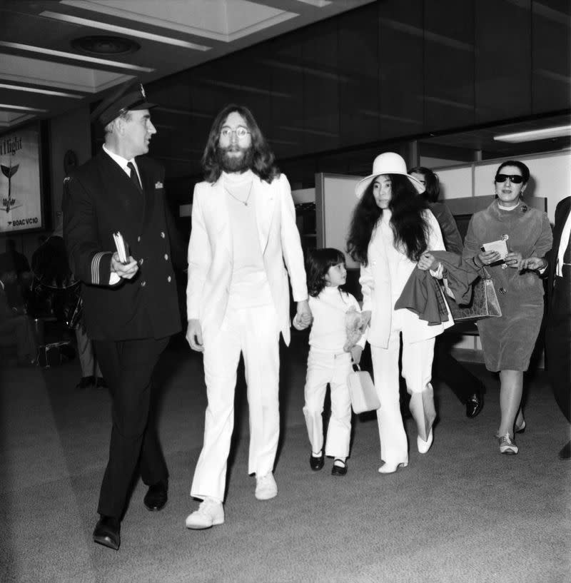 <p>John Lennon, Yoko Ono, and John's son Julian Lennon at Heathrow Airport in 1970. </p>