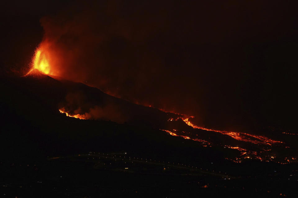 Lava erupts from a volcano near El Paso on the island of La Palma in the Canaries, Spain, Monday Sept. 20, 2021. Giant rivers of lava are tumbling slowly but relentlessly toward the sea after a volcano erupted on a Spanish island off northwest Africa. The lava is destroying everything in its path but prompt evacuations helped avoid casualties after Sunday's eruption. (Europa Press via AP) *