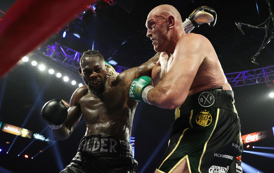 LAS VEGAS, NEVADA - FEBRUARY 22:  Tyson Fury punches Deontay Wilder during their Heavyweight bout for Wilder's WBC and Fury's lineal heavyweight title on February 22, 2020 at MGM Grand Garden Arena in Las Vegas, Nevada. (Photo by Al Bello/Getty Images)