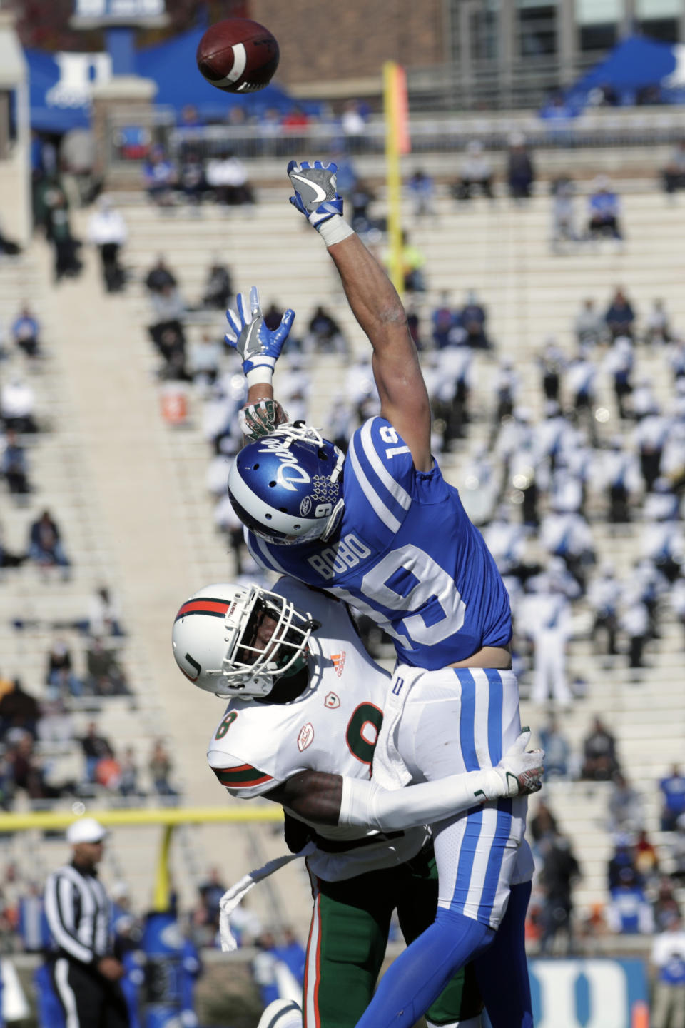 Duke wide receiver Jake Bobo (19) can't make the pass reception as Miami cornerback DJ Ivey (8) defends during the first half of an NCAA college football game Saturday, Nov. 27, 2021, in Durham, N.C. (AP Photo/Chris Seward)