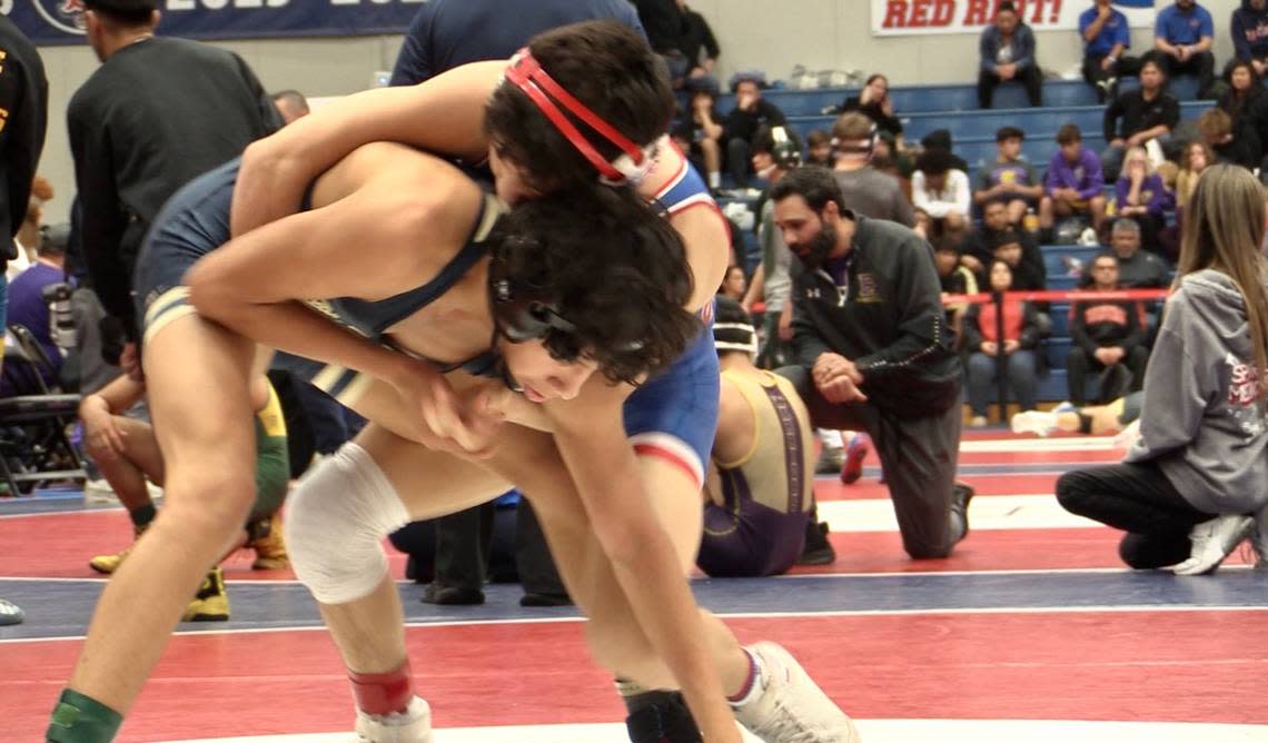 Christopher Huerta of Buchanan, wrestlers Anthony Ayon of Golden Valley-Bakersfield in 115s at the Masters at Buchanan High in Clovis, California on Friday, Feb. 17, 2023.