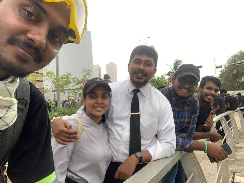 Chiranthaka Palugaswewa, a 29-year-old criminal defense attorney from Hambantota in southern Sri Lanka, poses with friends before a protest amid outcry over an unprecedented economic crisis.