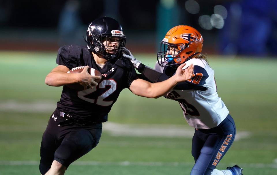 LeRoy running back Tony Piazza is pushed out of bounds by Attaica/Alexander’s Samuel Strzelec.