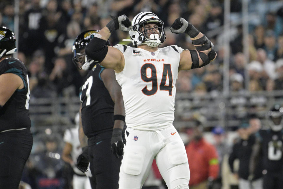 Cincinnati Bengals defensive end Sam Hubbard (94) reacts after sacking Jacksonville Jaguars quarterback Trevor Lawrence during the first half of an NFL football game, Monday, Dec. 4, 2023, in Jacksonville, Fla. (AP Photo/Phelan M. Ebenhack)