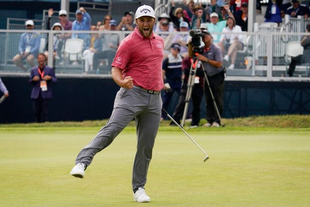 Jon Rahm celebrates on the 18th