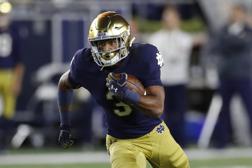 FILE - In this Sept. 29, 2018, file photo, Notre Dame's Avery Davis rushes during the second half of an NCAA college football game against Stanford in South Bend, Ind. Notre Dame junior Avery Davis is a case study in perseverance. He joined the Irish in 2017 as a dual-threat quarterback, then through attrition and position competition was moved to running back in 2018, then to cornerback to start this season before injuries brought him back to running back. Davis scored some credibility, and his first collegiate touchdown, last weekend to give the seventh-ranked Irish a boost heading to a showdown at No. 3 Georgia. (AP Photo/Carlos Osorio, File)