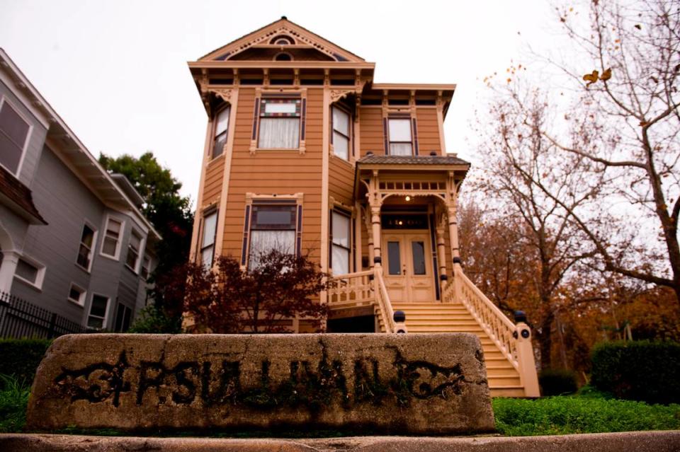 A concrete block with the name P. Sullivan stands on the sidewalk in 2010 in front of a Victorian home at 11th and E streets in Alkali Flat, Sacramento’s oldest existing residential neighborhood.
