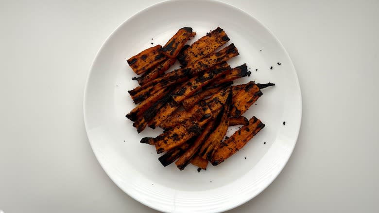 cooked carrots on white place 