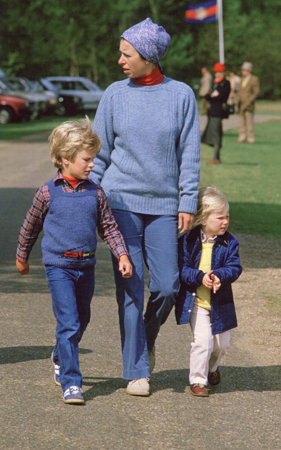 Princess Anne wearing a headscarf, with her children Peter and Zara - Tim Graham