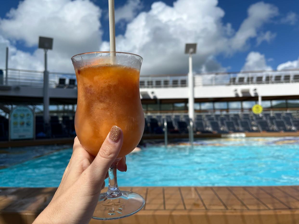 cocktail in front of pool on symphony of the seas