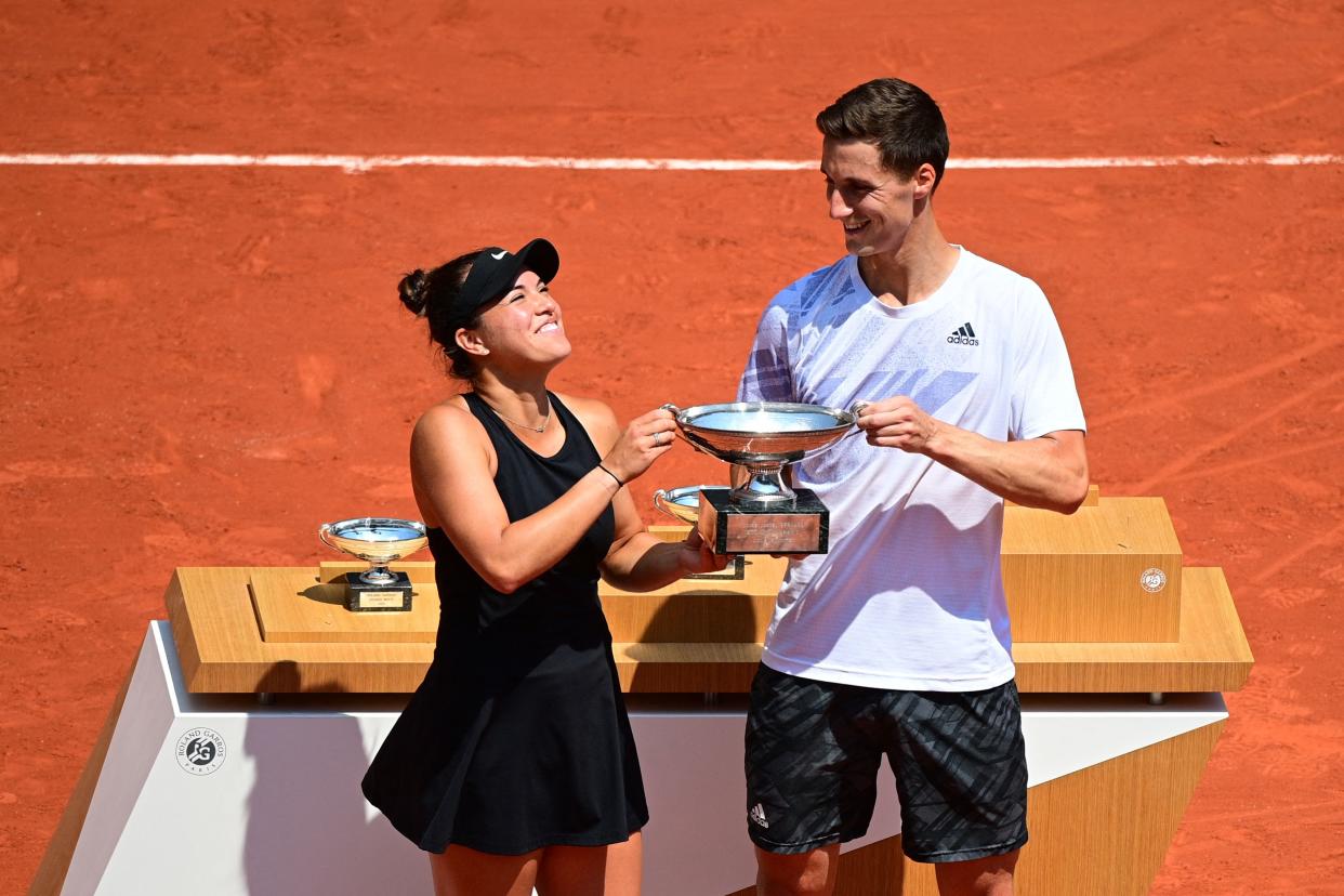 Desirae Krawczyk of the US (L) and Britain's Joe Salisbury celebrate with the trophy