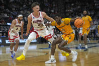 Arizona guard Pelle Larsson (3) defends against Long Beach State guard Jadon Jones (12) as he drives during the first half of a first-round college basketball game in the NCAA Tournament in Salt Lake City, Thursday, March 21, 2024. (AP Photo/Rick Bowmer)