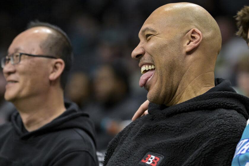 LaVar Ball smiles with his tongue out during a game between the Charlotte Hornets and Indiana Pacers.
