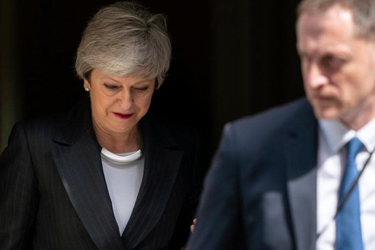 Theresa May halts vote on new Brexit deal as her leadership enters 'death spiral'