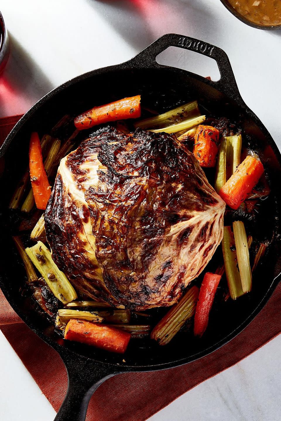 <p>This gorgeous, whole-roasted stunner is the perfect holiday substitute for vegans. It's savory, sweet, and salty on the outside and <em>super</em>-tender on the inside. Topped with lots of silky <a href="https://www.delish.com/cooking/recipe-ideas/recipes/a50251/vegetable-gravy-recipe/" rel="nofollow noopener" target="_blank" data-ylk="slk:mushroom gravy;elm:context_link;itc:0;sec:content-canvas" class="link ">mushroom gravy</a>, we doubt anyone at your table will be missing meat.</p><p>Get the <strong><a href="https://www.delish.com/holiday-recipes/thanksgiving/a24850980/thanksgiving-cabbage-recipe/" rel="nofollow noopener" target="_blank" data-ylk="slk:Whole Roasted Cabbage recipe;elm:context_link;itc:0;sec:content-canvas" class="link ">Whole Roasted Cabbage recipe</a></strong>.</p>