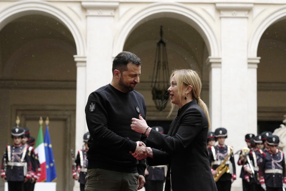 FILE - Italian Premier Giorgia Meloni meets Ukrainian President Volodymyr Zelenskyy shake hands before their meeting at Chigi Palace, Government's office, in Rome, Saturday, May 13, 2023. While the world awaits Ukraine's spring offensive, its leader Volodymyr Zelenskyy has already launched a diplomatic one. In a span of a week, he has dashed to Italy, the Vatican, Germany, France and Britain to shore up support for the defense of his country. On Friday, May 19, 2023, he was in Saudi Arabia to meet with Arab leaders, some of whom are allies with Moscow. (AP Photo/Alessandra Tarantino, File)