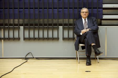 Maricopa County Sheriff Joe Arpaio listens to U.S. Republican presidential candidate Donald Trump speak at a campaign rally in Marshalltown, Iowa January 26, 2016. Arpaio endorsed Trump at the rally. REUTERS/Brian Snyder