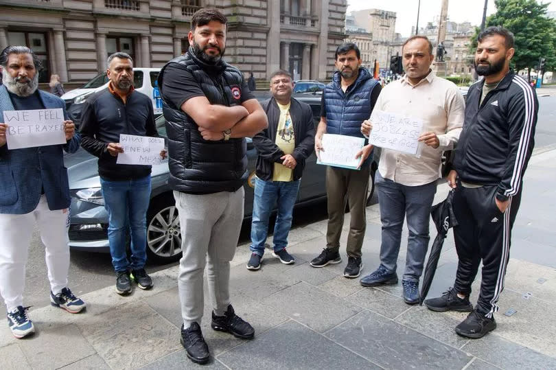 Wajid Khalil along with several Taxi drivers that find themselves in the same position