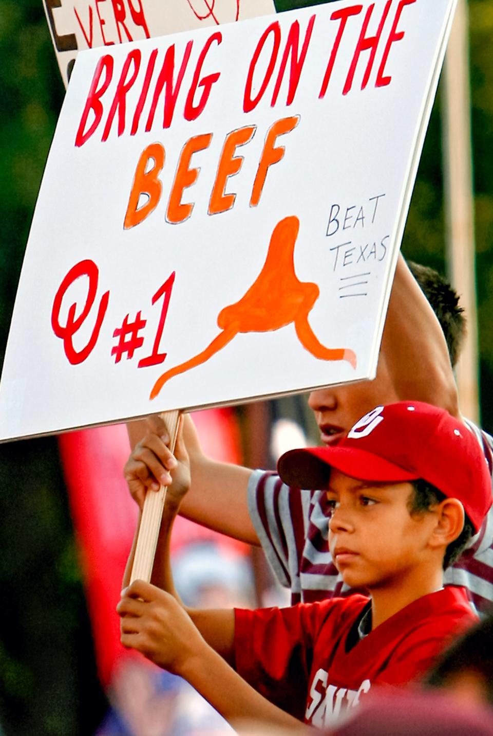 A Sooners fan holds up a sign in an effort to get noticed on ESPN's College GameDay broadcast before the 2008 Texas-Oklahoma game. Saturday's matchup of No. 3 Texas and No. 12 OU will again draw GameDay to the Cotton Bowl.