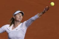 Russia's Maria Sharapova serves against Estonia's Kaia Kanepi during their women's first round match of the French Open, in Paris, on May 25, 2015