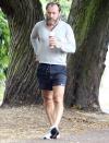 <p>Jude Law returns from his solo Wednesday morning run in a London park with a coffee.</p>