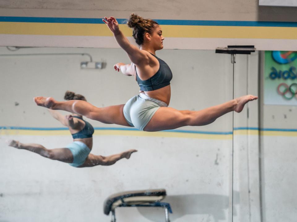 Laurie Hernandez in the splits in the air.