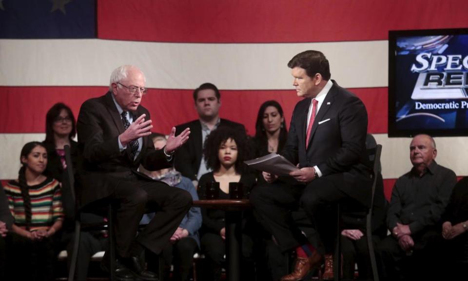 Sanders talks with moderator Bret Baier during a Fox town hall in Detroit in March 2016.