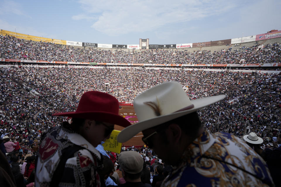 Spectators wait for a bullfight at the Plaza Mexico, in Mexico City, Sunday, Jan. 28, 2024. Bullfighting returned to Mexico City after the Supreme Court of Justice overturned a 2022 ban that prevented these events from taking place in the capital. (AP Photo/Fernando Llano)