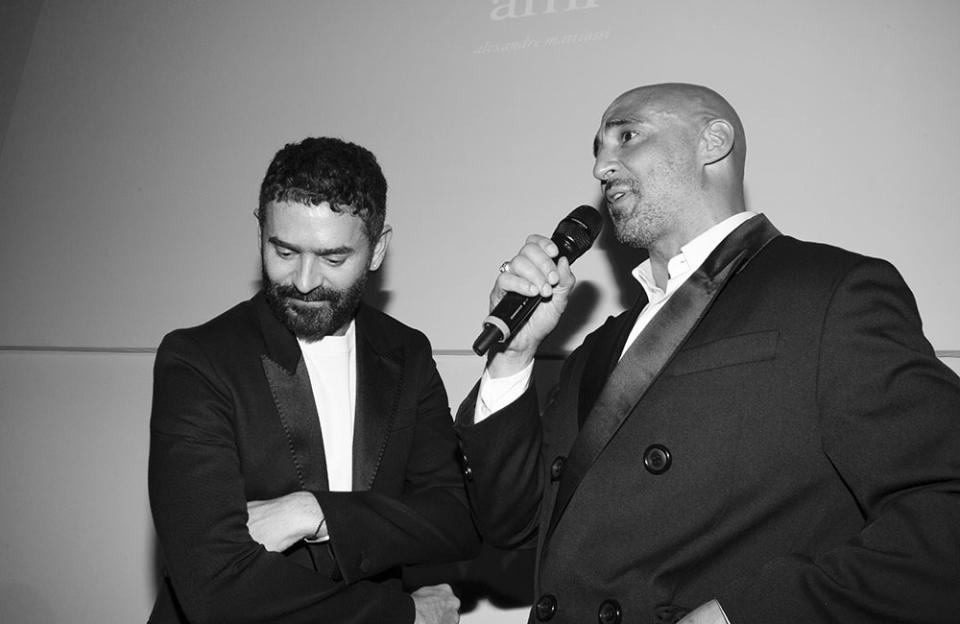 Yann Demange speaks while Alexandre Mattiusi listens in during AMI’s cocktail party in Cannes on May 18, 2022. - Credit: Courtesy of AMI